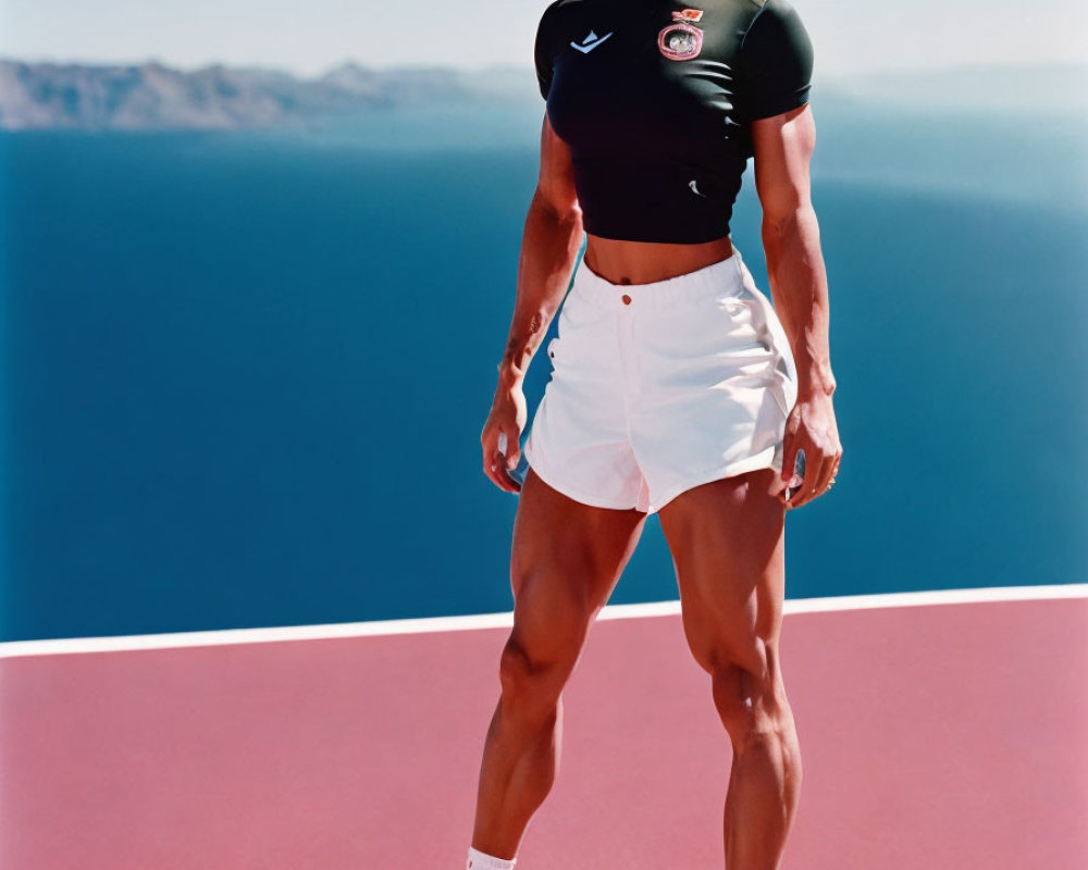 Fit Female Athlete in Black Crop Top and White Shorts