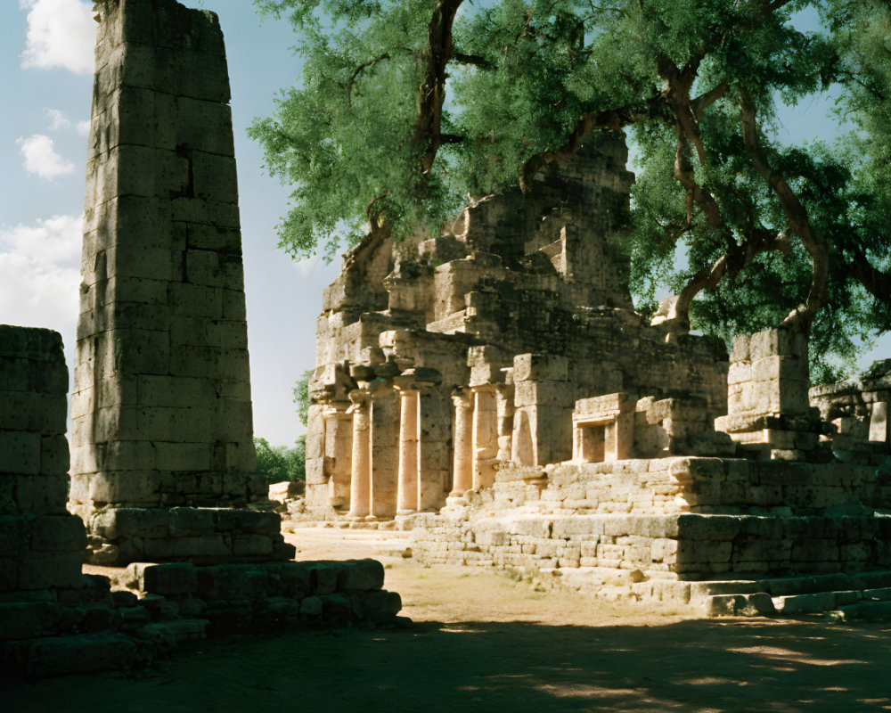 Stone ruins with columns and archways in a serene natural setting