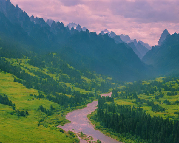 Serene landscape: meandering river, lush valleys, misty mountains