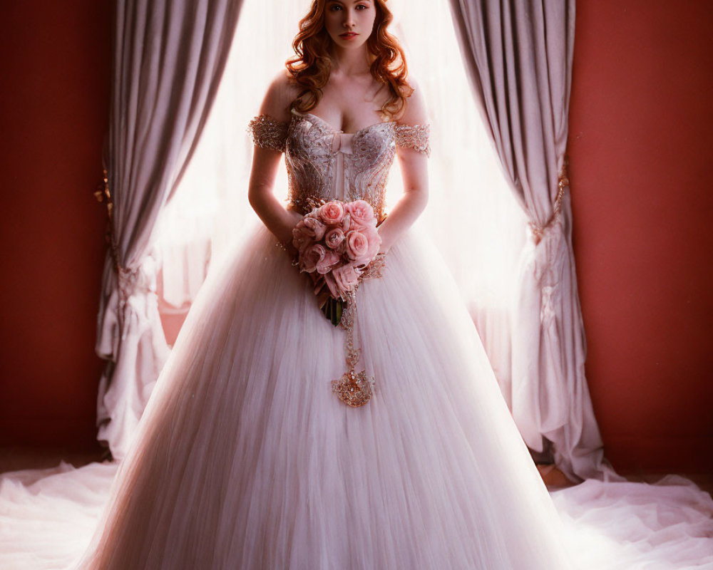 Elegant bride in off-shoulder wedding gown with bouquet by window