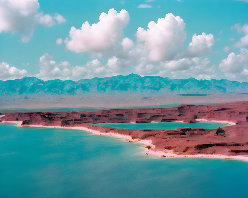 Tranquil landscape: Turquoise lake, reddish-brown cliffs, mountain range