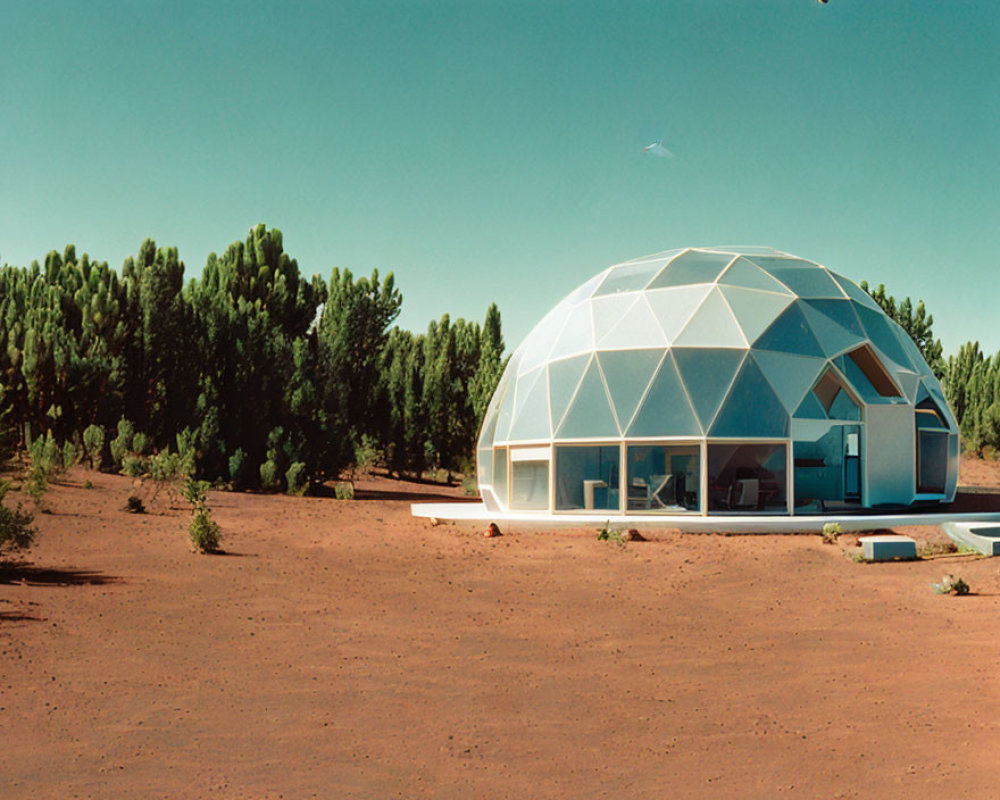 Geodesic Dome House with Large Triangular Windows in Desert Landscape