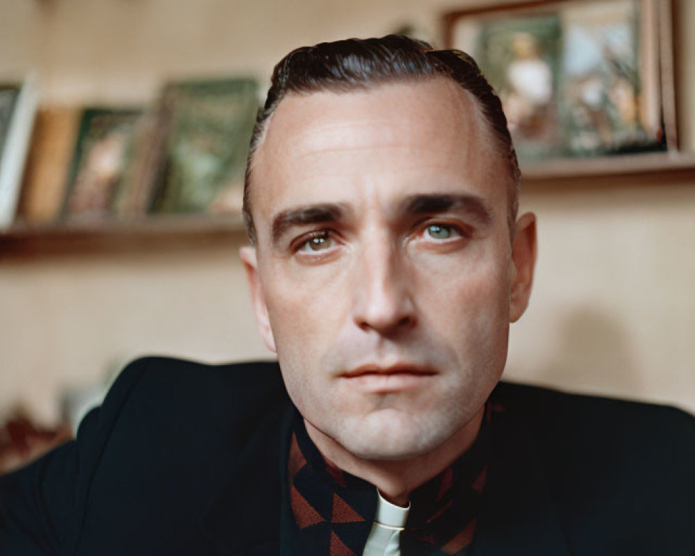 Man with Slicked-Back Hair in Dark Jacket and Bowtie Portrait