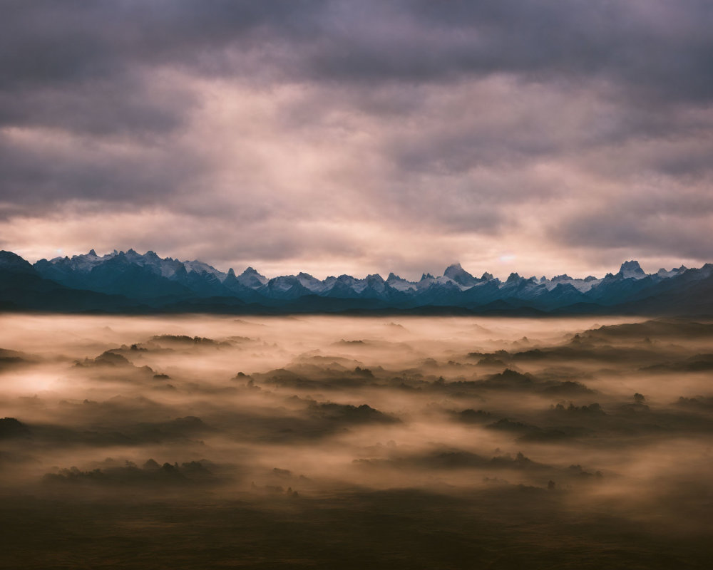 Mystical landscape: fog-covered valleys, dramatic sky, rugged mountains