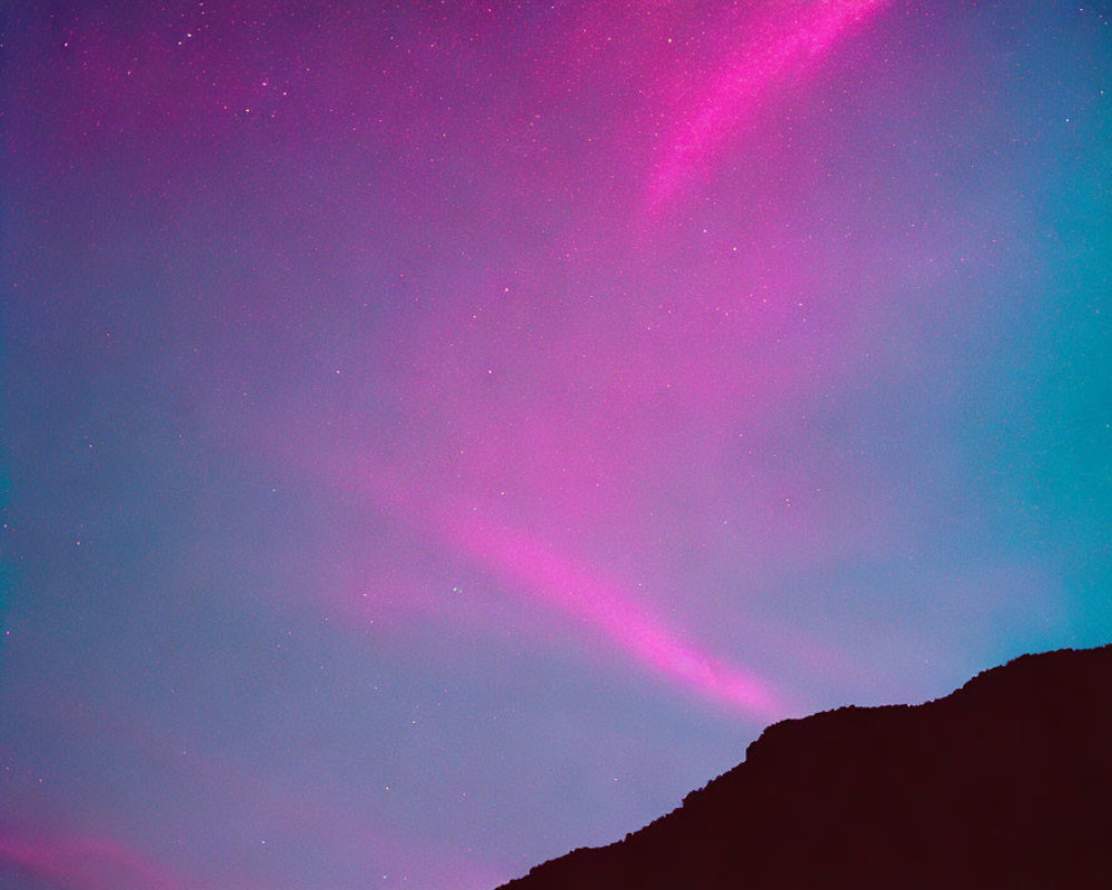Starry Night Sky with Pink and Purple Auroras Above Dark Mountain