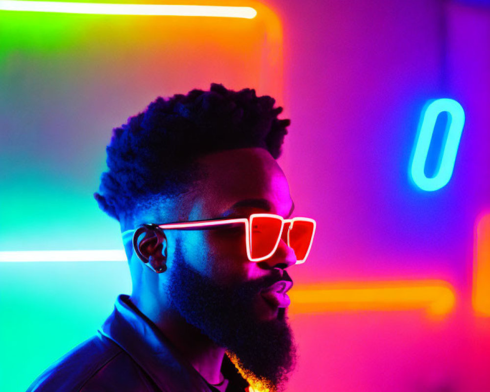 Bearded man in sunglasses and leather jacket against neon lights