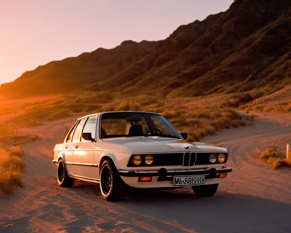 Vintage White BMW Car Parked on Deserted Road at Sunset