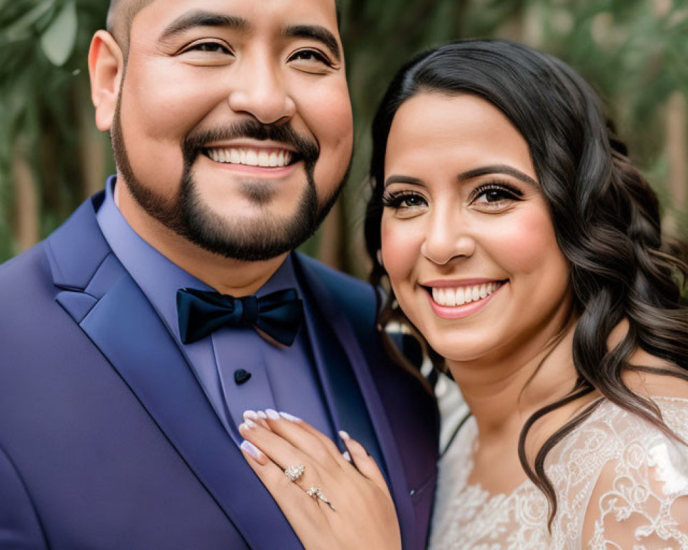 Stylish couple in blue suit and white lace dress with engagement ring