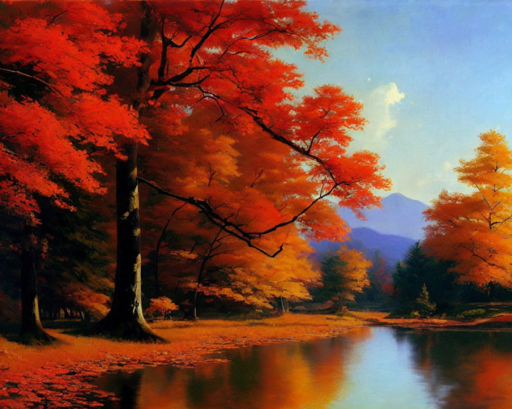 Autumn foliage in red and orange by tranquil river with mountain backdrop