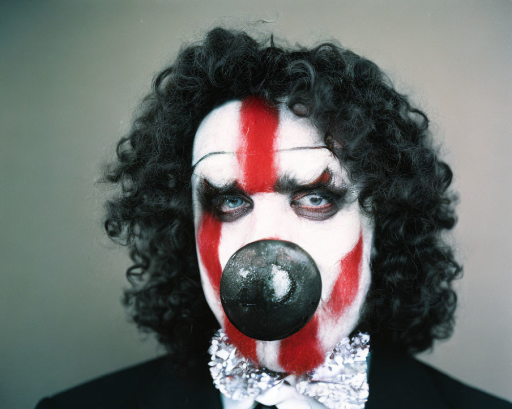 Intense stare of a person in clown makeup