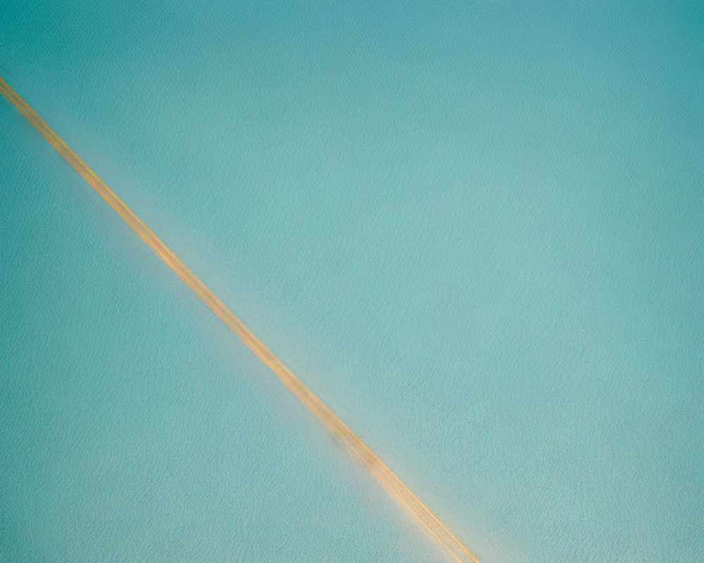 Serene aerial view of narrow sandbar in blue waters