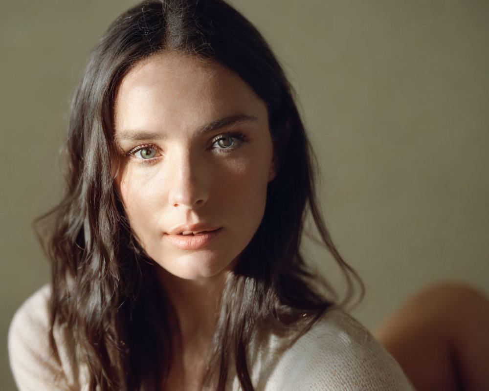 Portrait of Woman with Dark Hair and Green Eyes in Natural Light