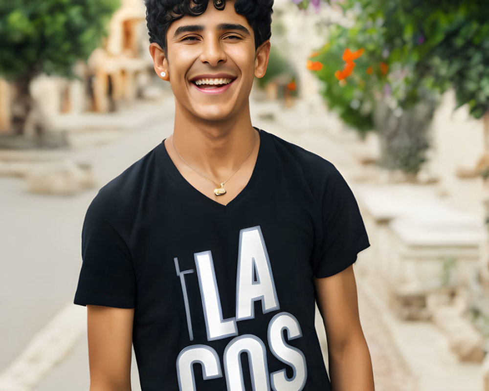 Smiling young man in black T-shirt on urban street