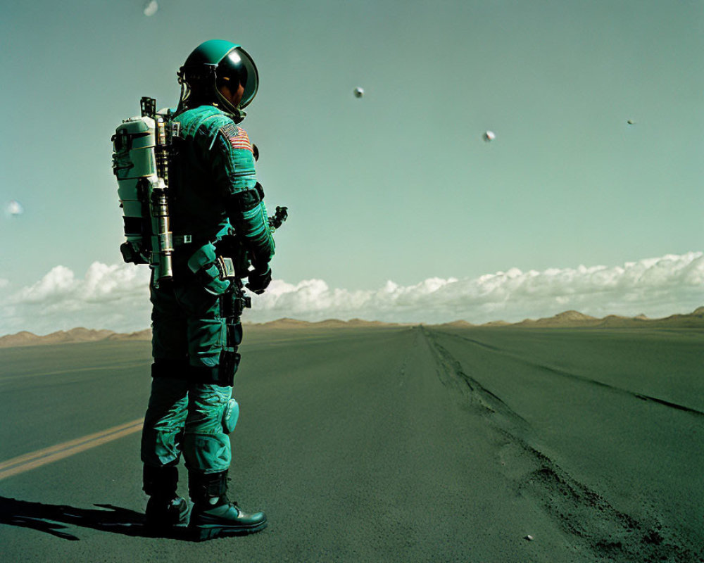 Spacesuit-clad figure on empty road under clear sky.