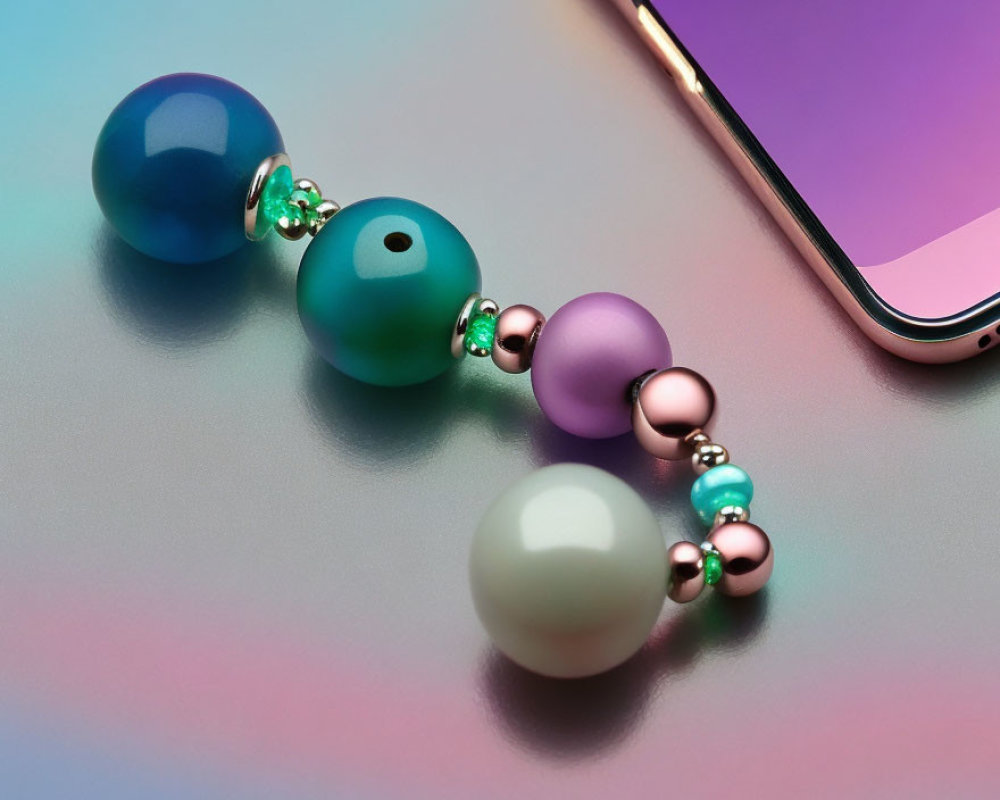 Colorful Bead Bracelet Next to Smartphone on Pastel Background