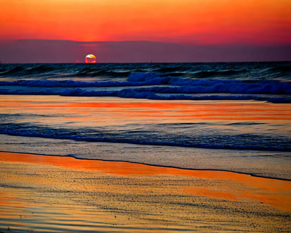 Vibrant orange and purple sunset over beach with gentle waves
