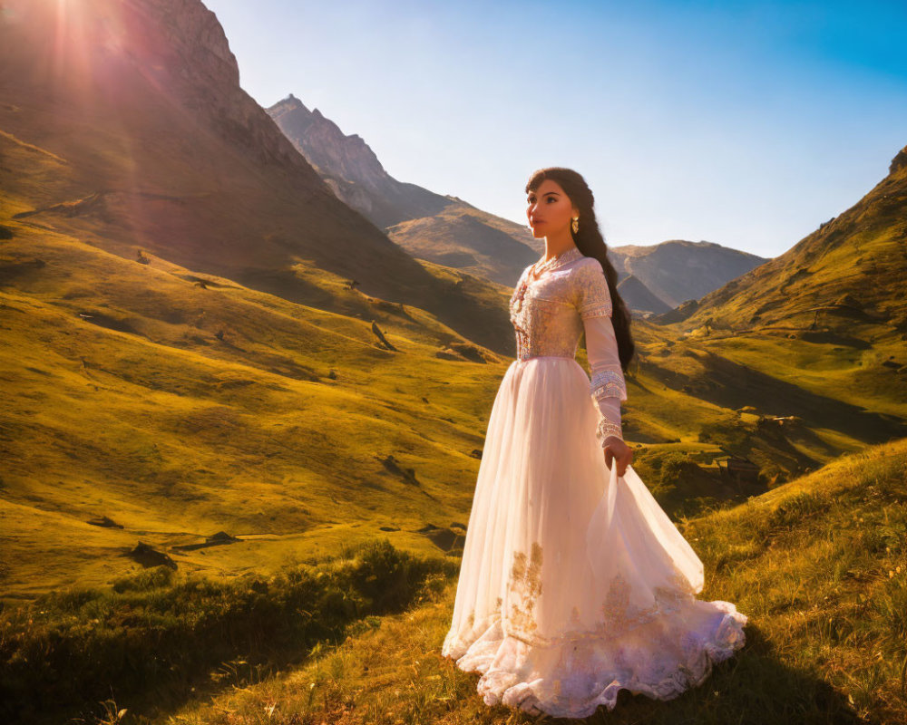 Woman in White Lace Dress Standing in Sunlit Mountain Landscape