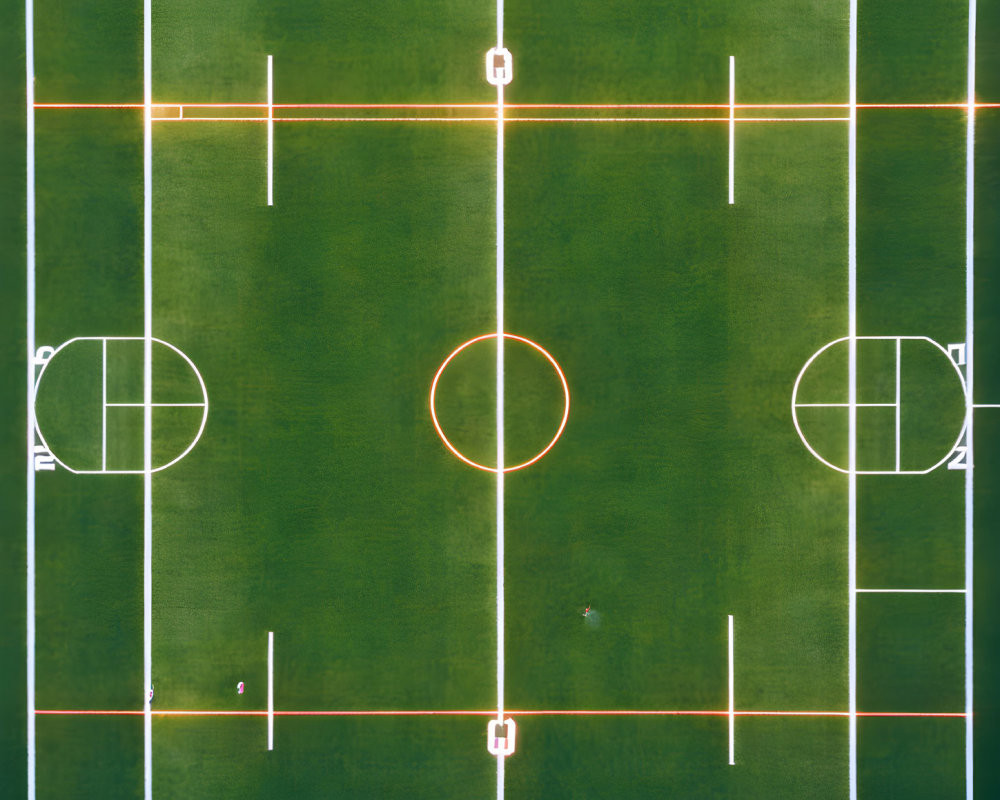 Soccer field with white markings, center circle, and goals