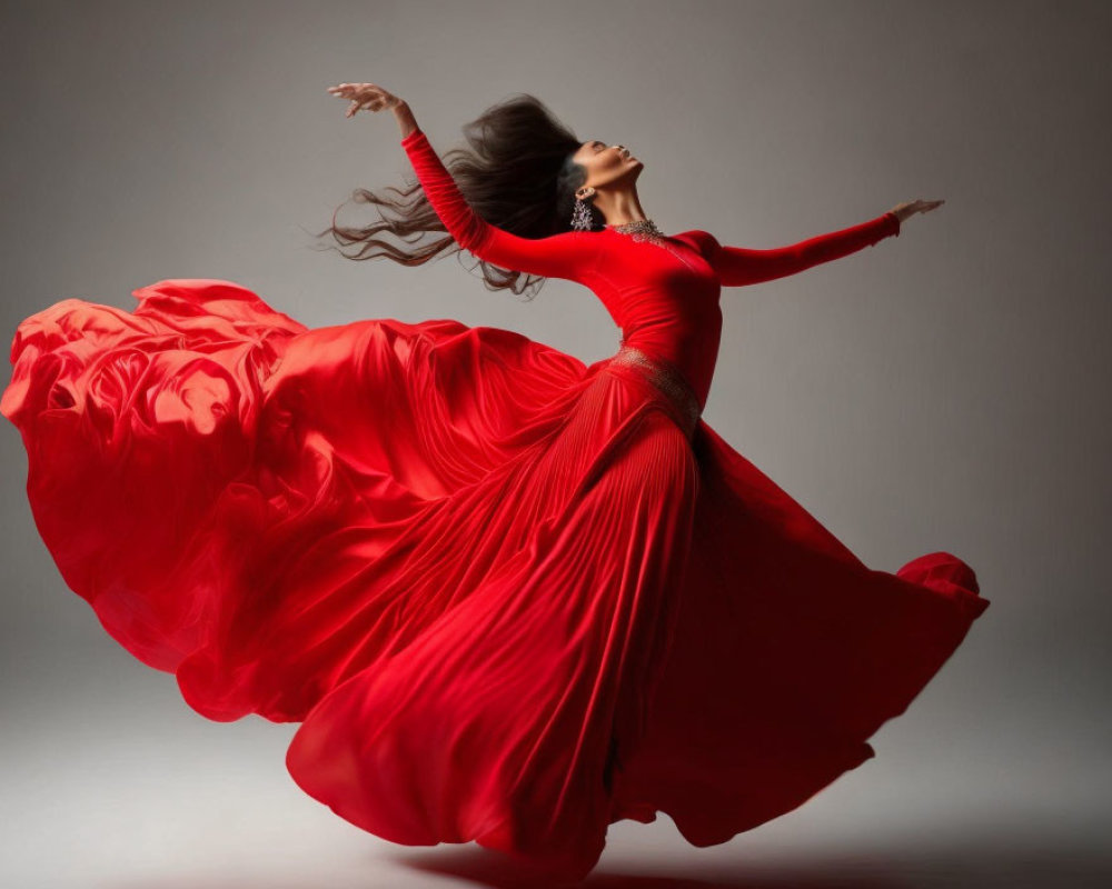 Woman in flowing red dress mid-twirl with billowing hair and gown