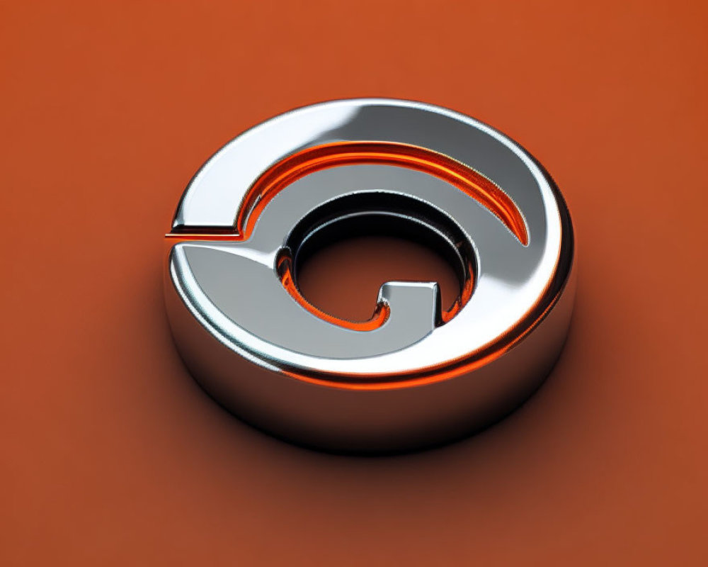 3D metallic at symbol on orange background